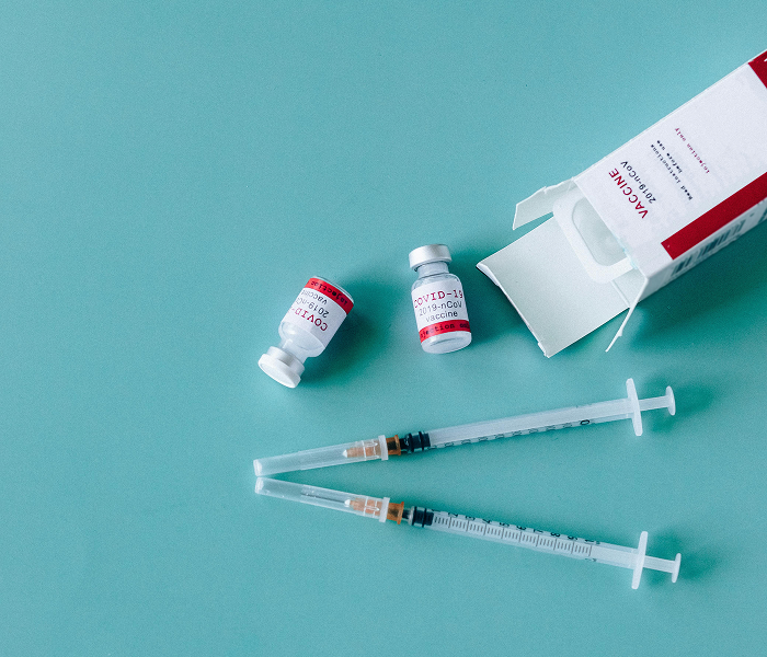 Child receiving vaccination at home